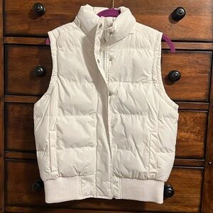 White puffer vest with zipper and snaps